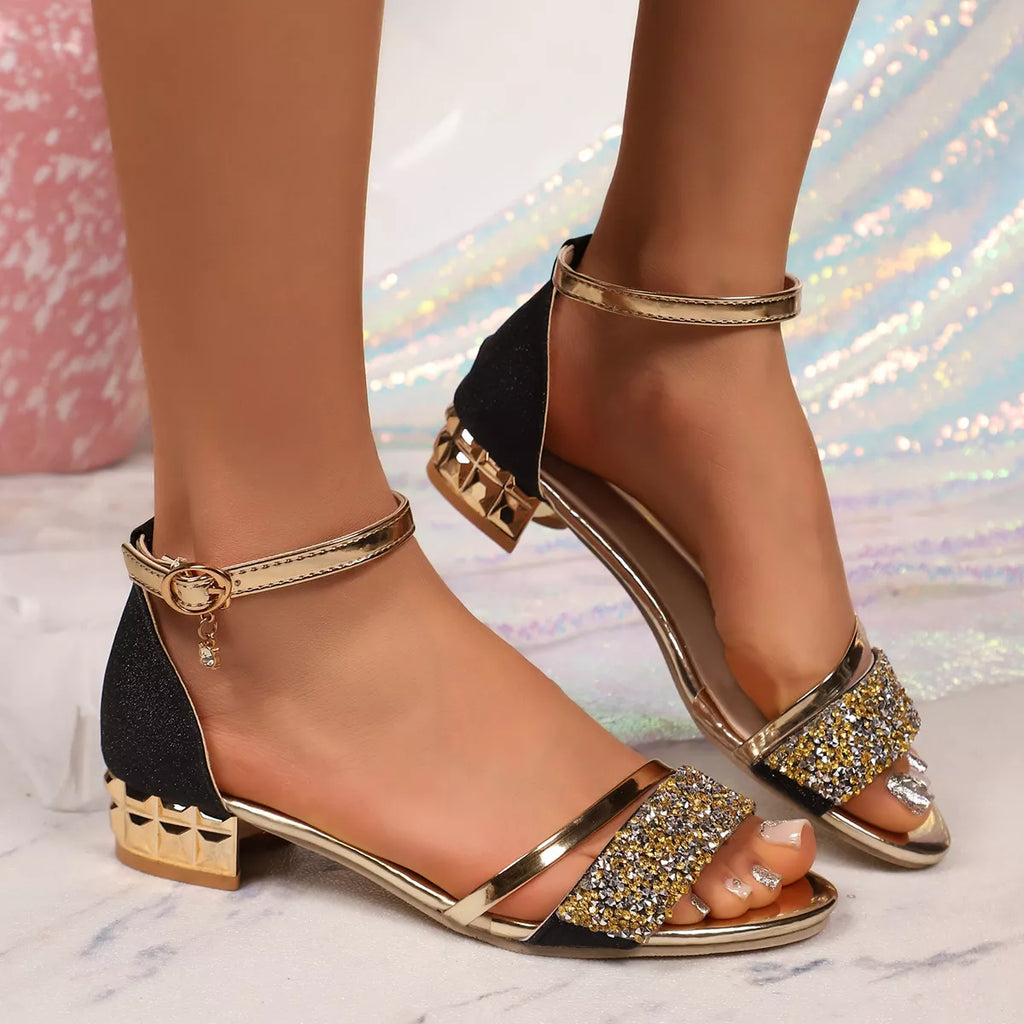 Black open-toe block heels with ankle strap and gold glitter front