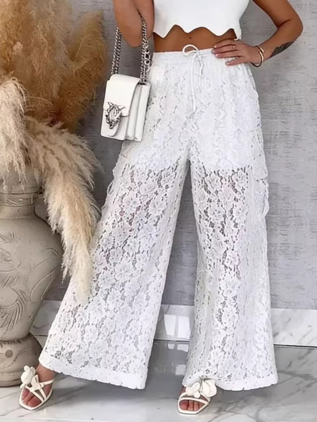 Women’s lace wide-leg pants, white—front view with tie waistband and flared wide legs