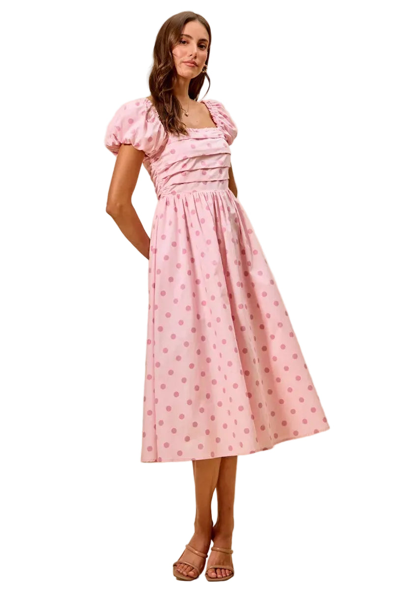 Pink polka-dot midi dress with puff sleeves and a gathered, flared skirt
