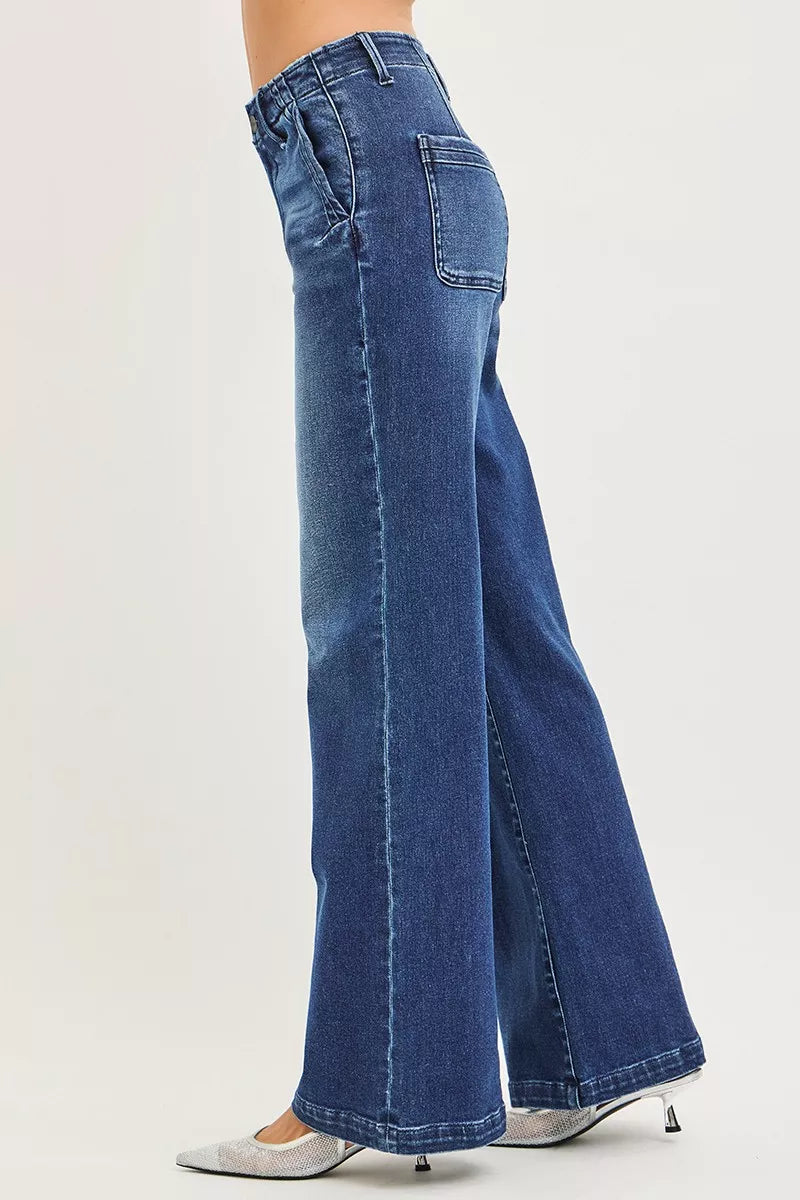 Side view: high-rise wide-leg jeans with slanted side pockets and stitched seams