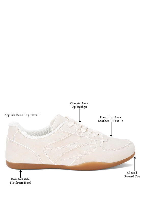 Ivory lace-up sneaker with cushioned closed round toe and stitched paneling