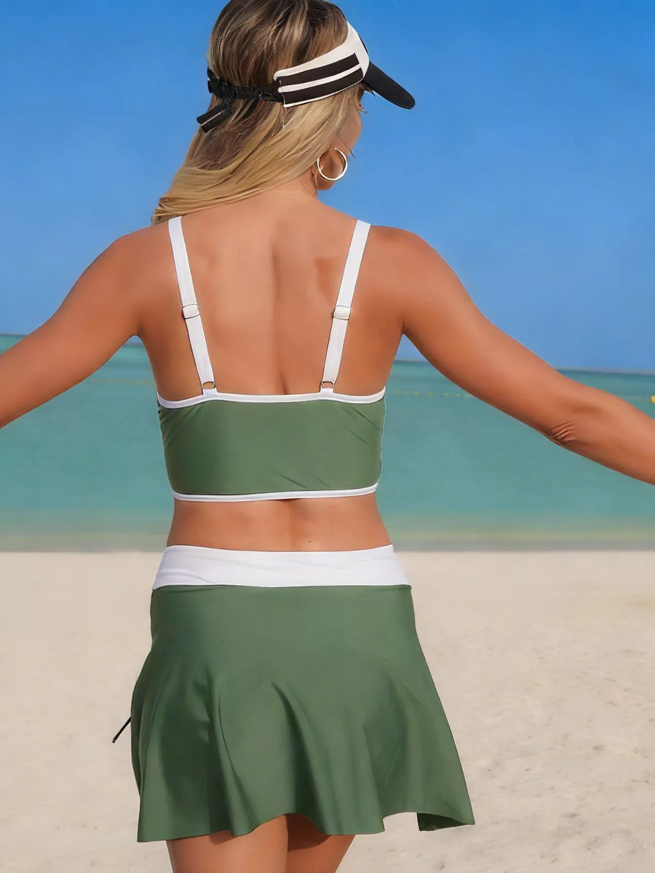 Back view army green swim set with contrast straps and flared ruched skirt