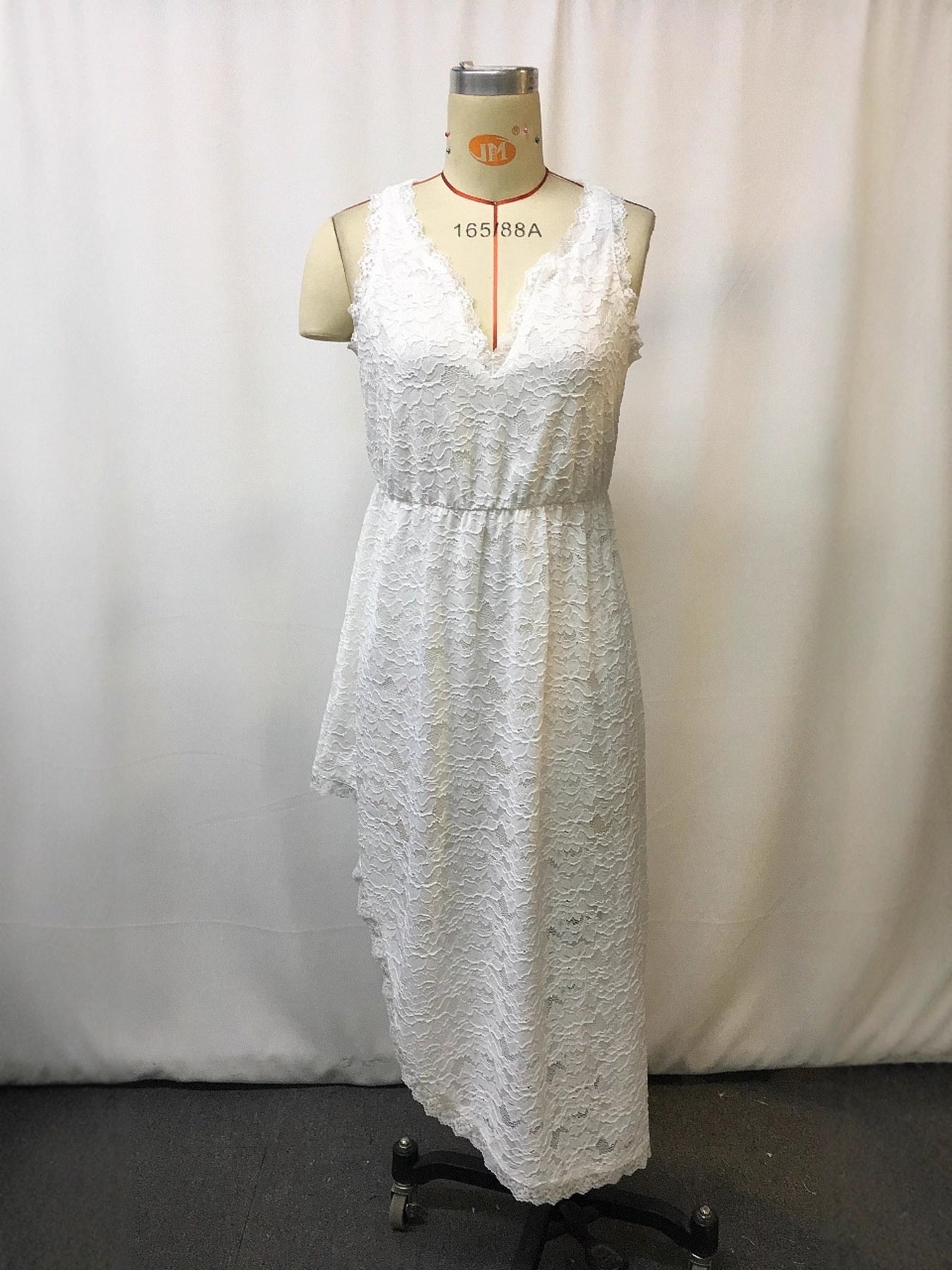 White lace sleeveless plus-size dress with deep V-neck and textured bodice