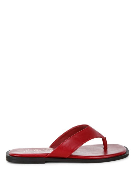 Red toe-post thong flats, angled view with flat sole and open square toe