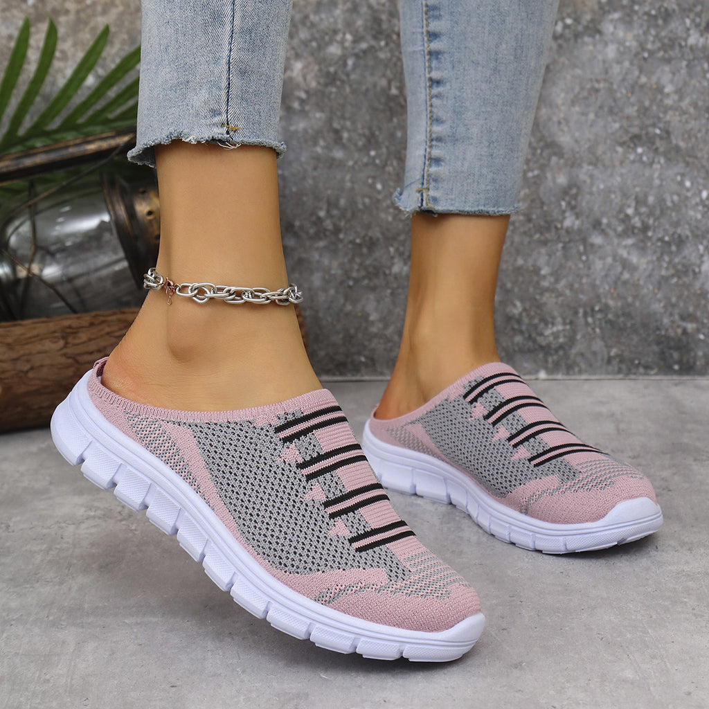 Pink/gray knit slip-on sneakers with black stripe pattern and white tread sole