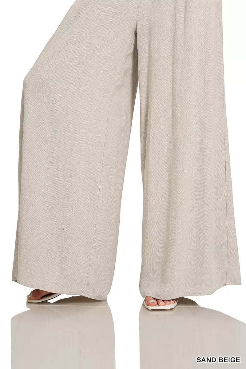Wide-leg lounge pants in sand beige with flowy drape and wide legs