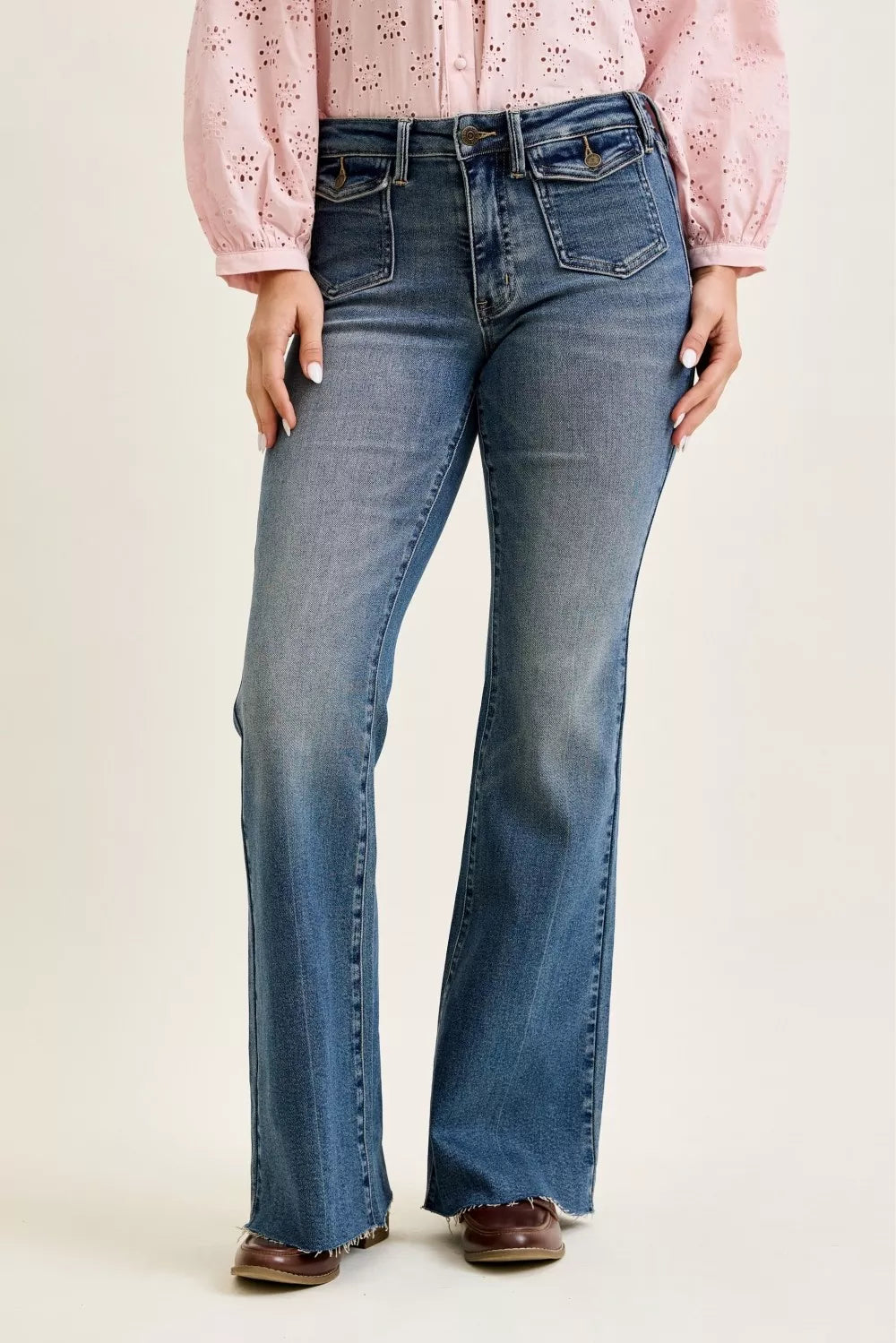Mid-rise flare jeans, dark wash denim, front flap pockets and belt loops
