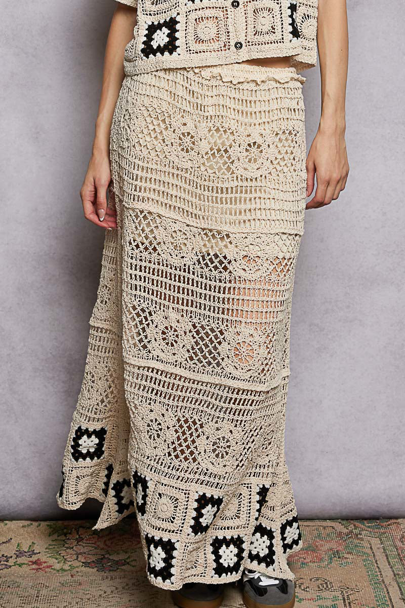 Natural maxi crochet skirt with ruffled waistband and black-and-white granny square hem