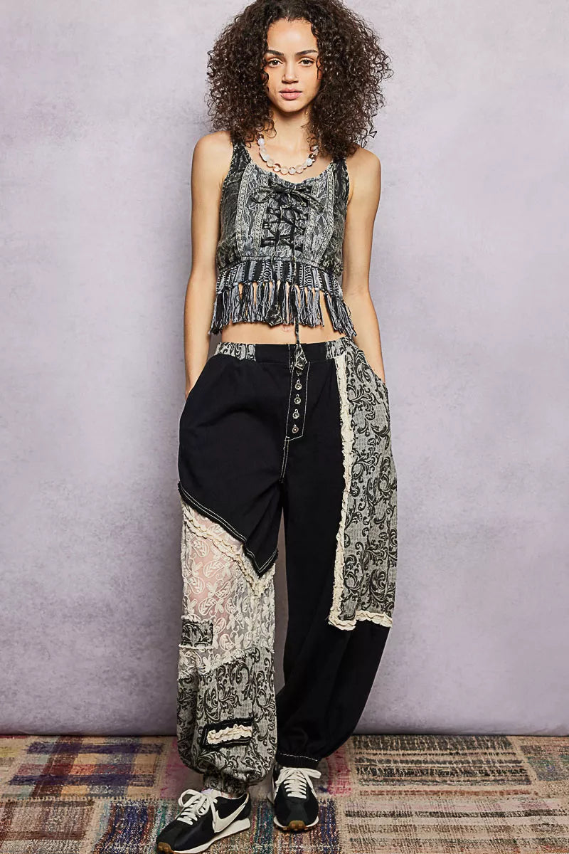 Charcoal lace-up fringe hem tank with allover lace print and tassel trim