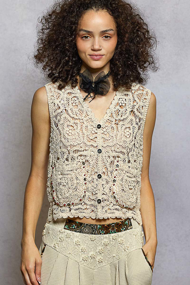 Cropped beige crochet vest with scalloped hem and button front