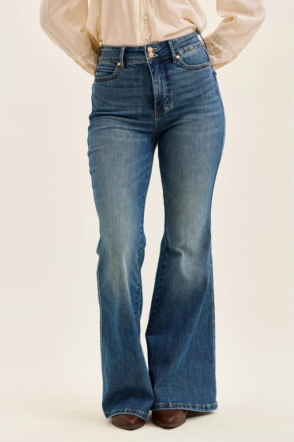 High-waist flare jeans in dark denim with double-button waist and straight front legs