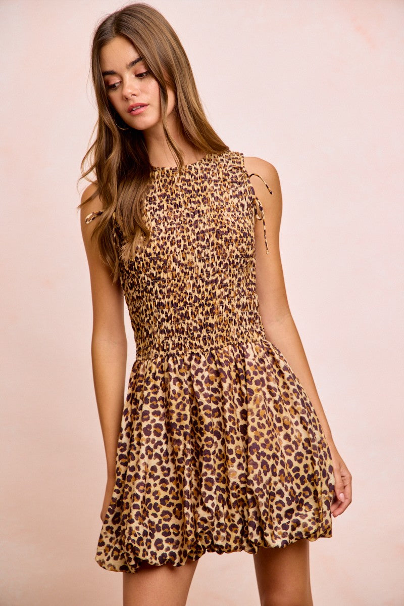 Leopard print mini dress with smocked waist, puff sleeves with tie accents