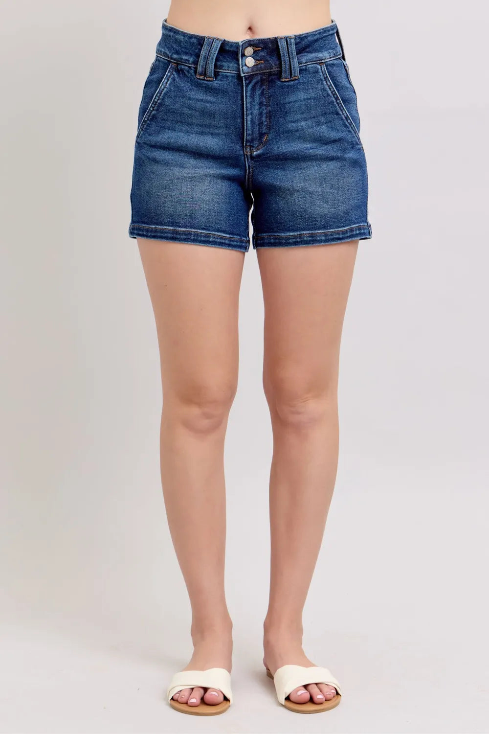 Dark denim shorts, front button closure and visible belt loops