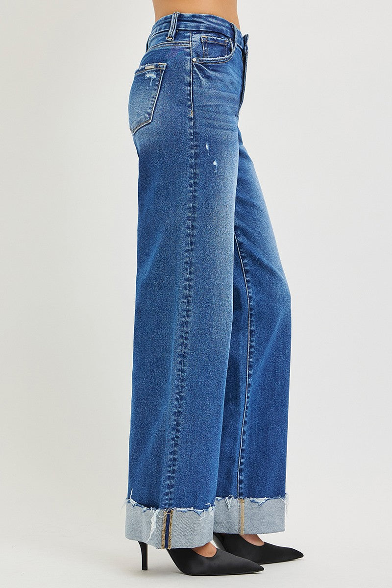 Back view: medium wash blue wide-leg jeans with two back pockets and cuffed hem