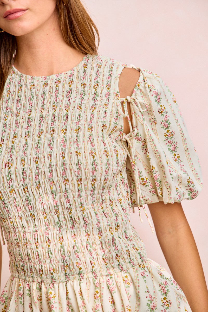 Ivory floral puff sleeves with bow ties; smocked neckline detail on dress