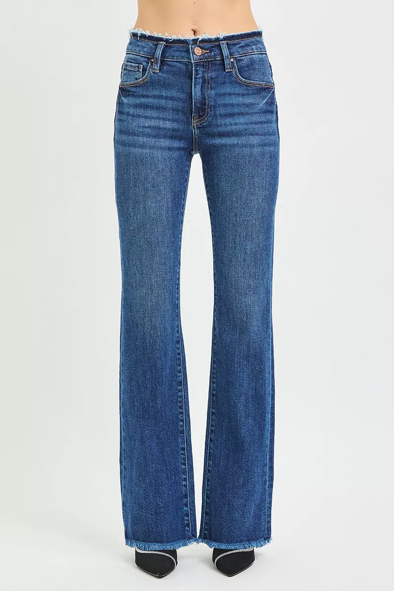 Dark blue bootcut jeans rear view with frayed hem and back yoke