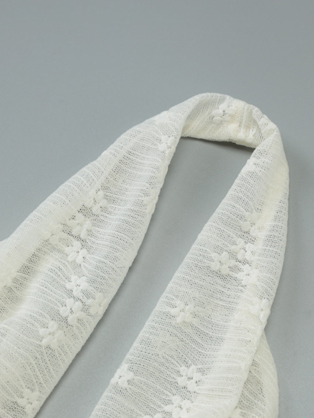 Cream halter neck strap with textured lace fabric