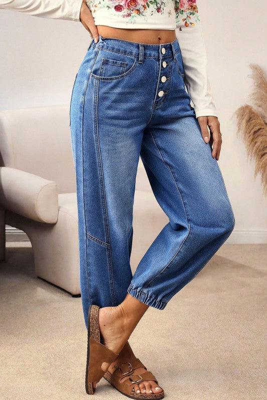 Blue tapered barrel-leg jeans with front pocket stitching and button placket