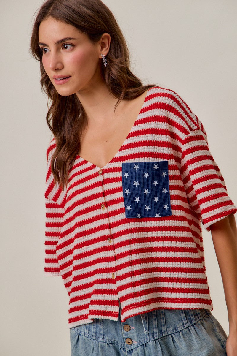 Striped knit cardigan top with blue star patch detail at the chest and button closure