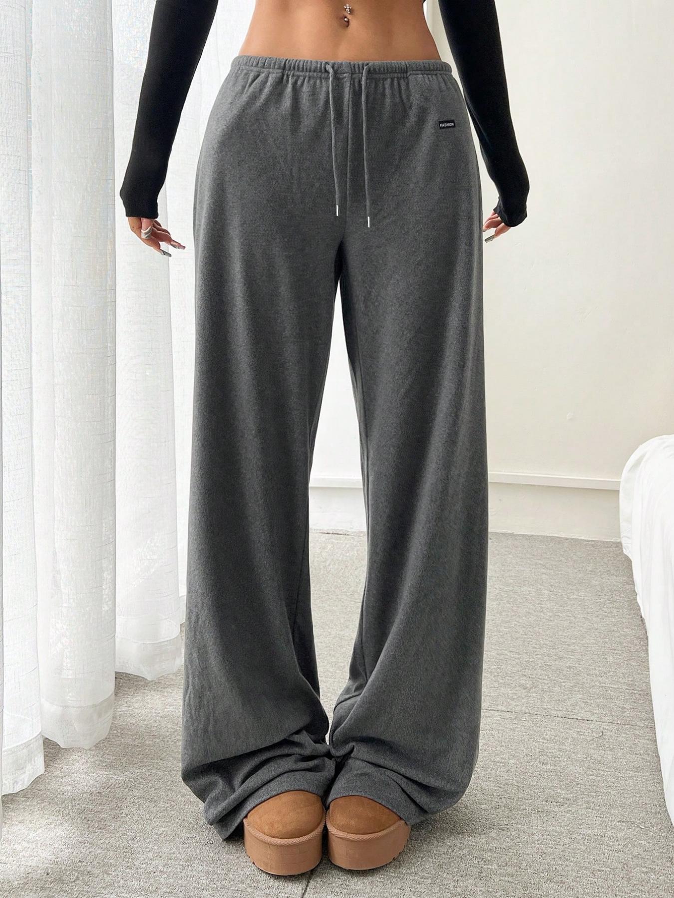Gray relaxed fit drawstring pants with elastic waist and side seam pockets