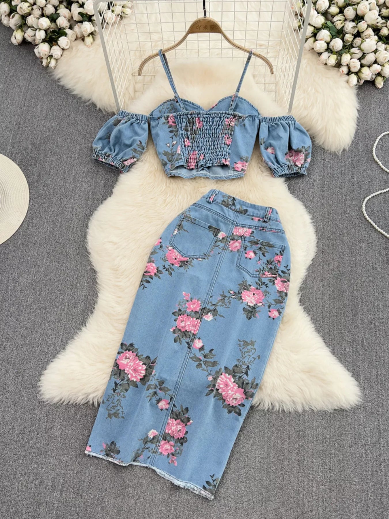 Blue floral denim skirt with button closure and pink flower print paired with cami top