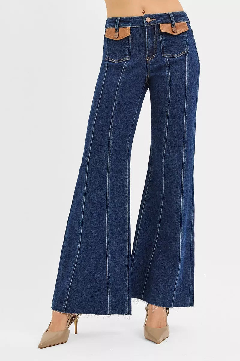 High-rise wide flare jeans, dark denim wash; front leather pocket detail