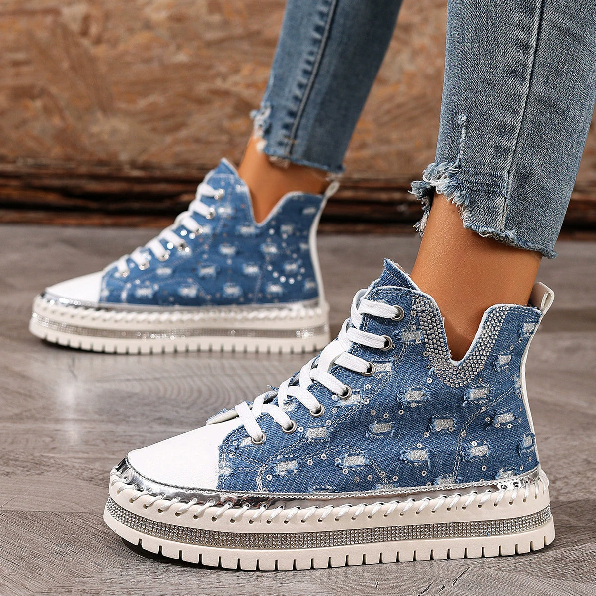 Blue lace-up platform sneakers with white laces, speckled studded denim look