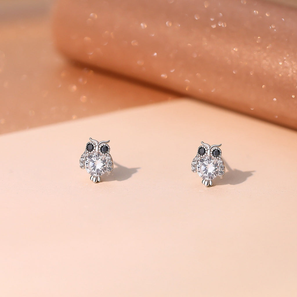 Owl stud earrings in silver with clear round stone body and black eye accents