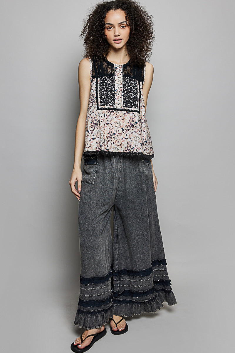 Black floral sleeveless top with button front and contrast lace neckline