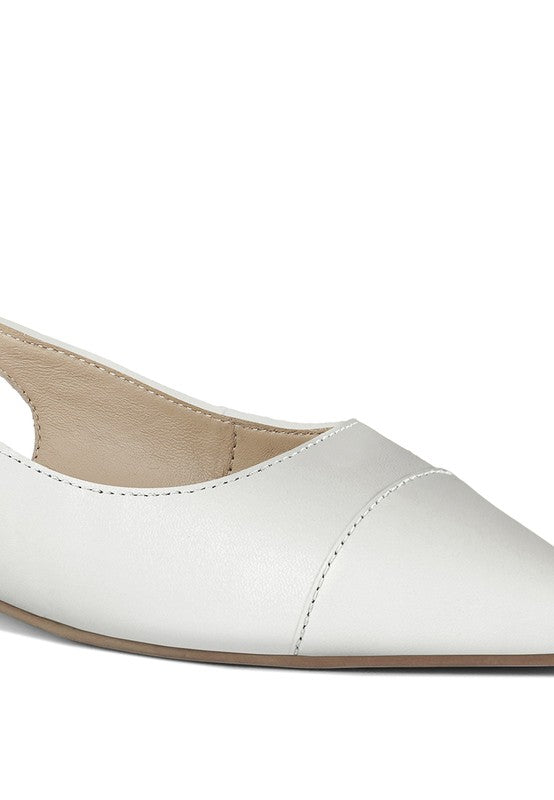 Close-up of white pointed-toe slingback flats with stitched leather upper