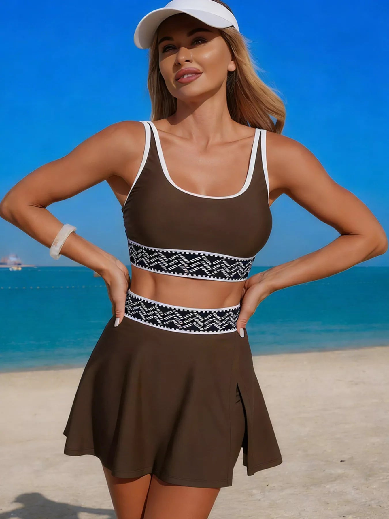 Brown tank and skort swim set with white trim and black patterned waistband