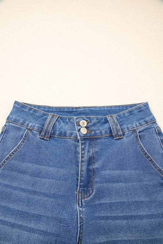 Straight-leg jeans waistband detail with button closure and belt loops