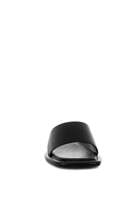 Black square-toe flat slide sandals, front view with open toe opening