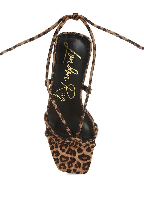 Leopard print square-toe heeled sandal close-up of straps over black footbed