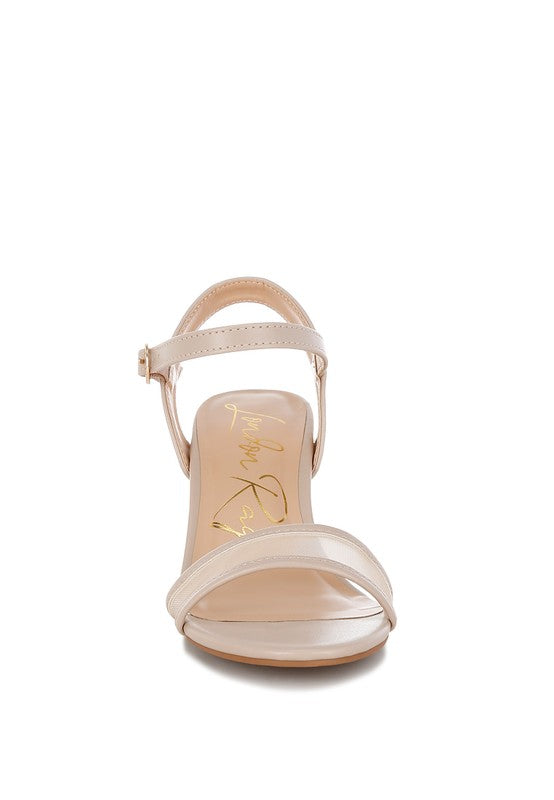 Beige mesh block heels with crisscross straps and open toe front view