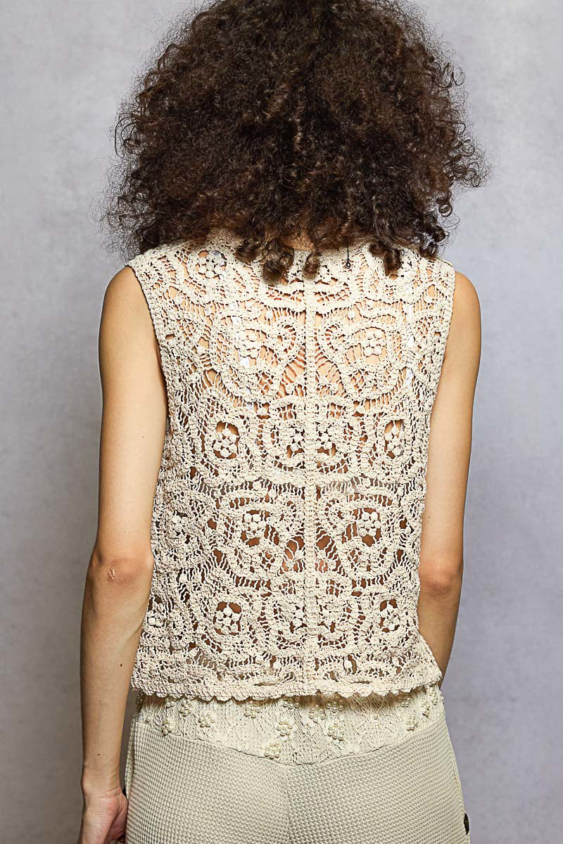 Back view of natural beige crochet vest with V-neck and scalloped edge