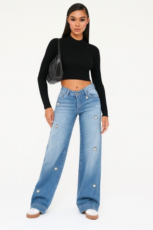 Low-rise light-wash jeans with diamond star accents on legs
