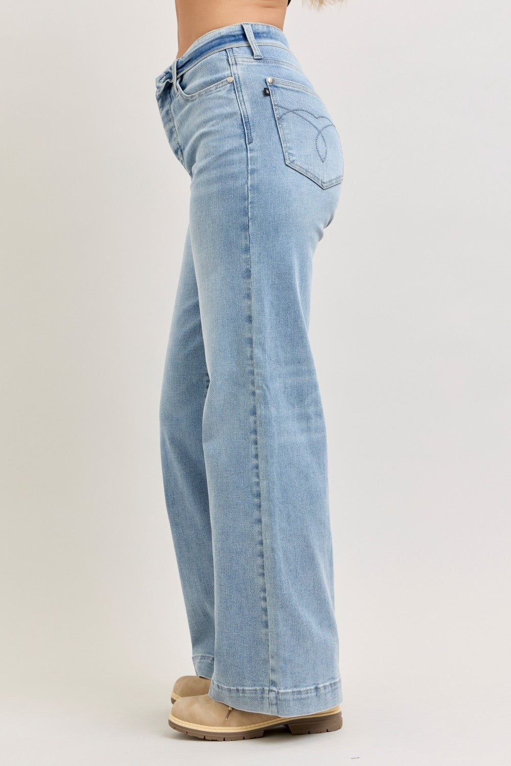 Light-wash wide-leg jeans back/side view with pocket stitching