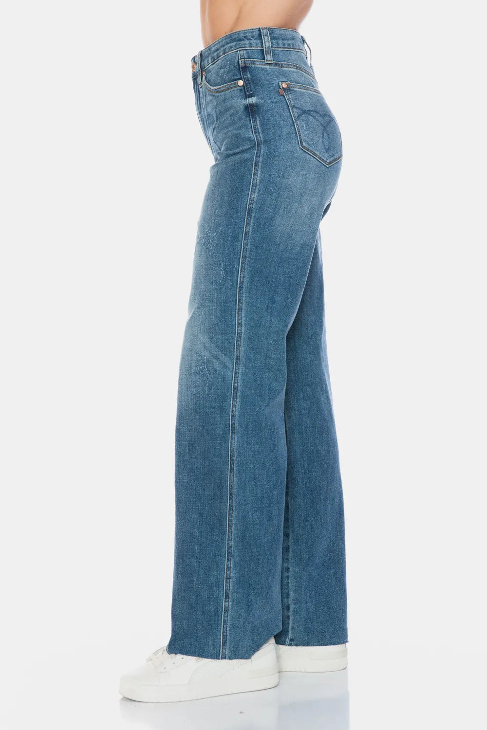 Medium-wash straight jeans back side view with rear pockets and raw hem