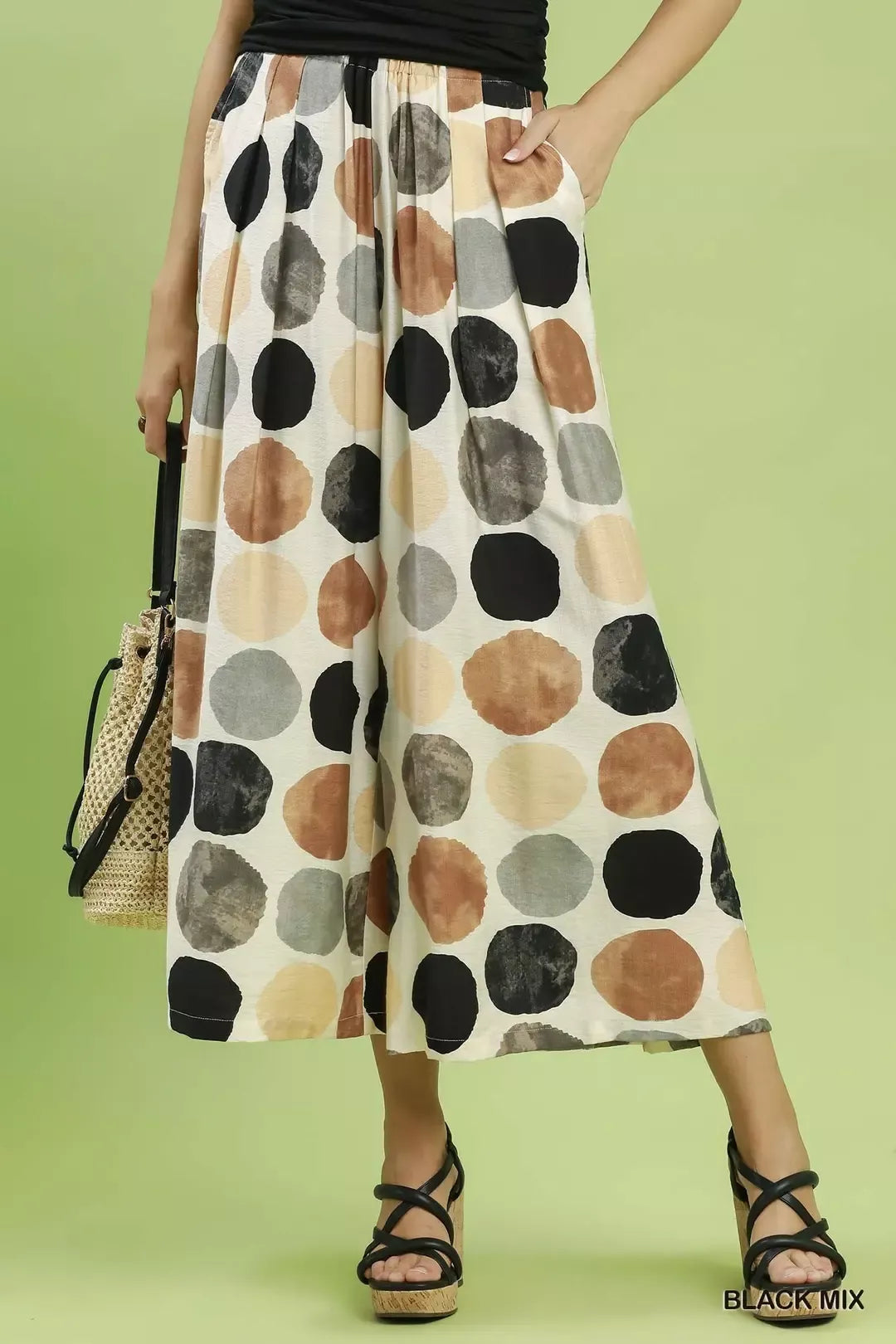 Umgee dot print wide-leg pants in Black Mix with elastic waist and flowy midi length