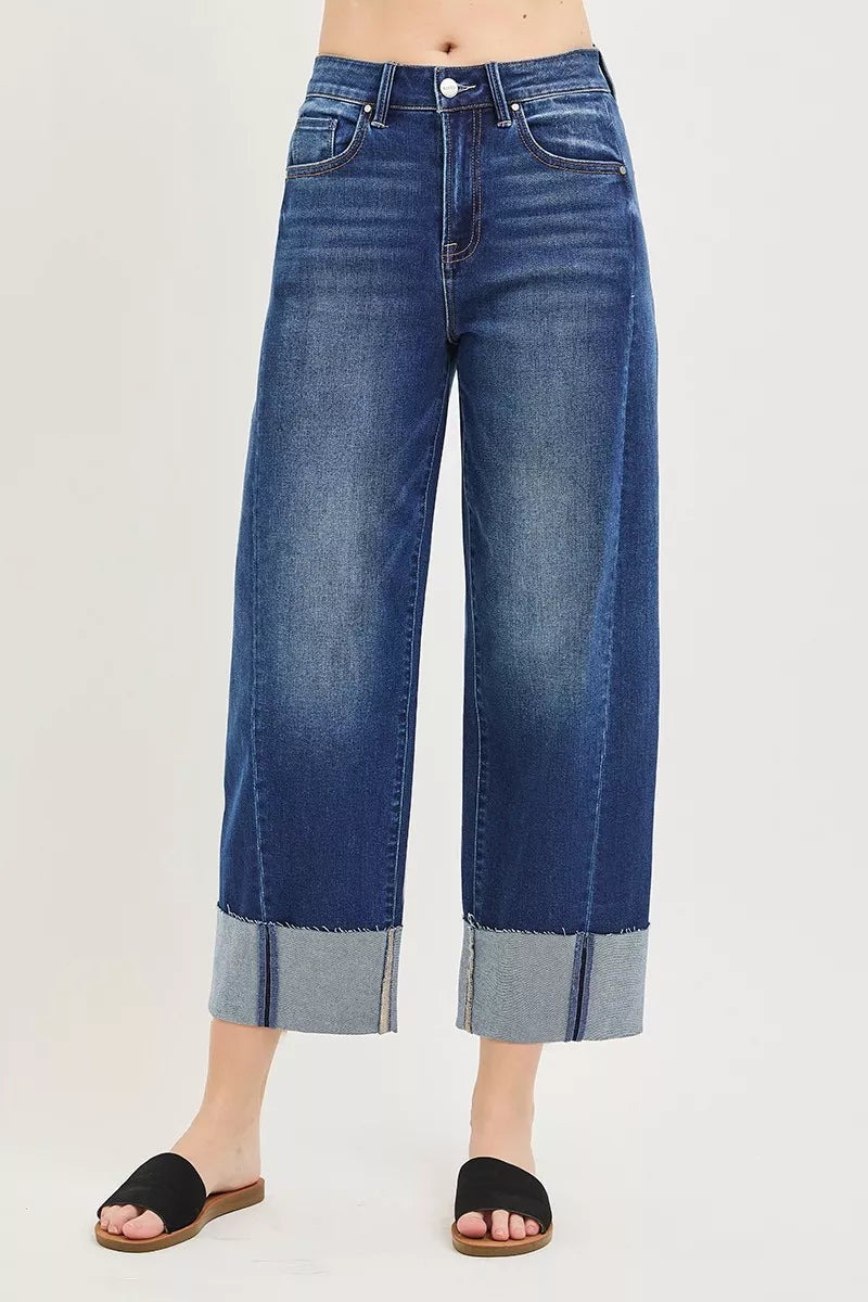 Front view dark blue crop barrel jeans with button fly and contrast cuff hem