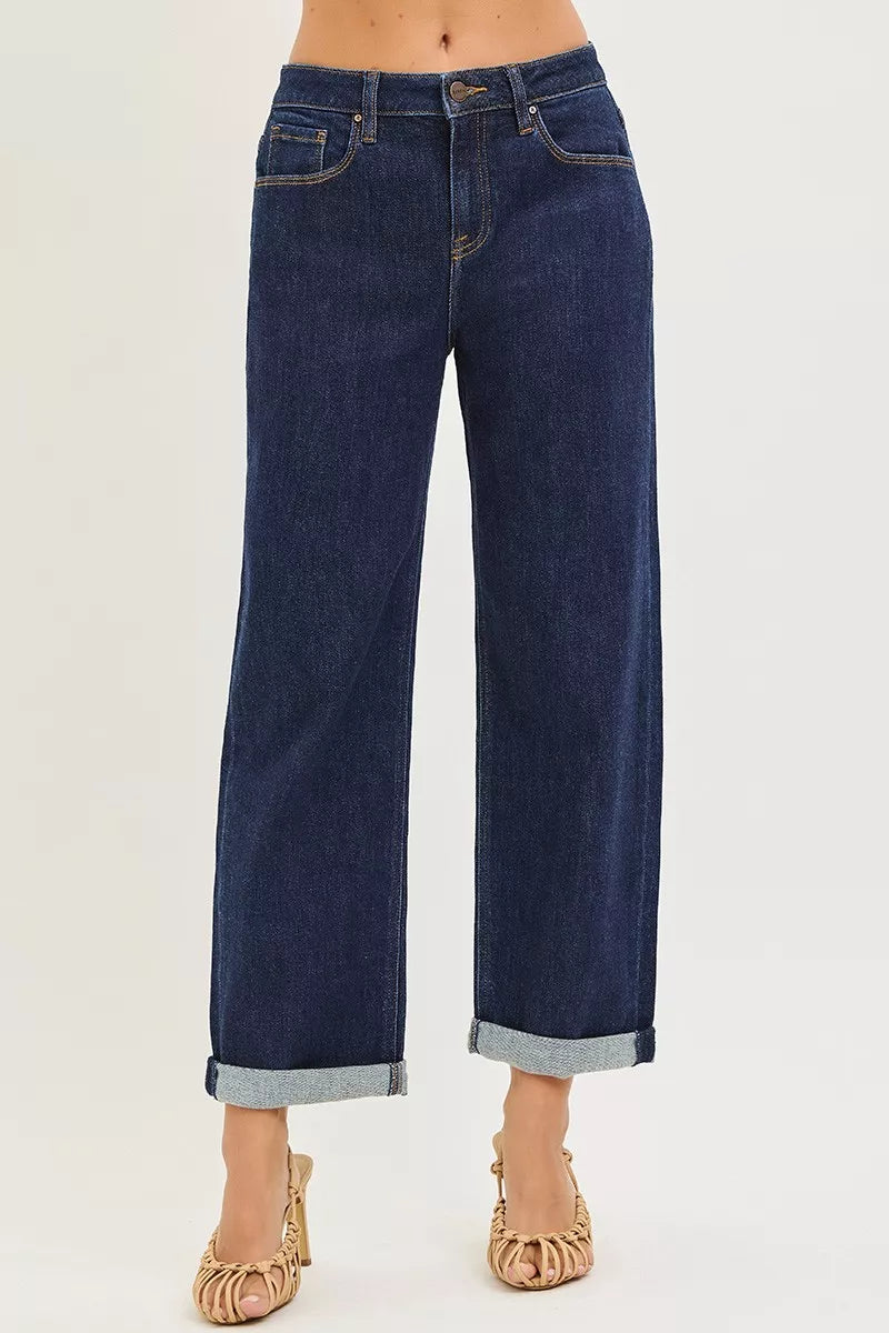 Dark blue boyfriend jeans with slouchy fit and cuffed hem.