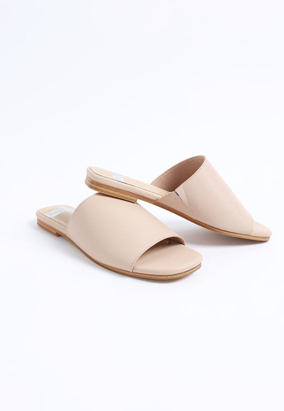 Beige open-toe slide flats with low flat heel, smooth leather upper