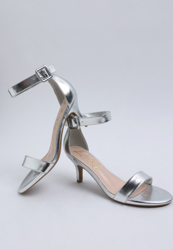 Metallic silver kitten heel sandals with double straps and ankle buckle closure