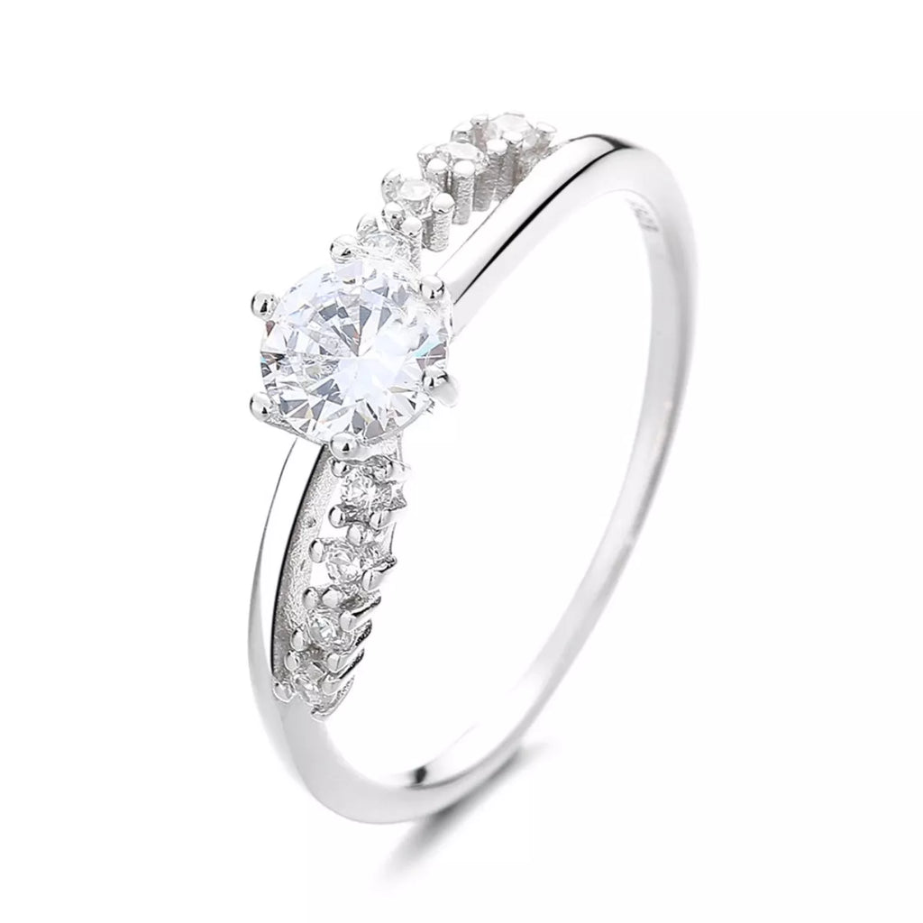 Silver zircon ring, side view: large round center stone with pavé band