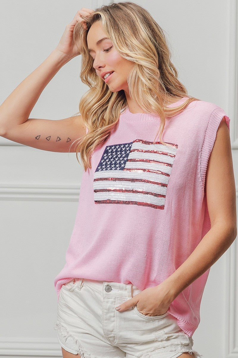 Pink sleeveless knit top with soft drape and American flag sequin patch