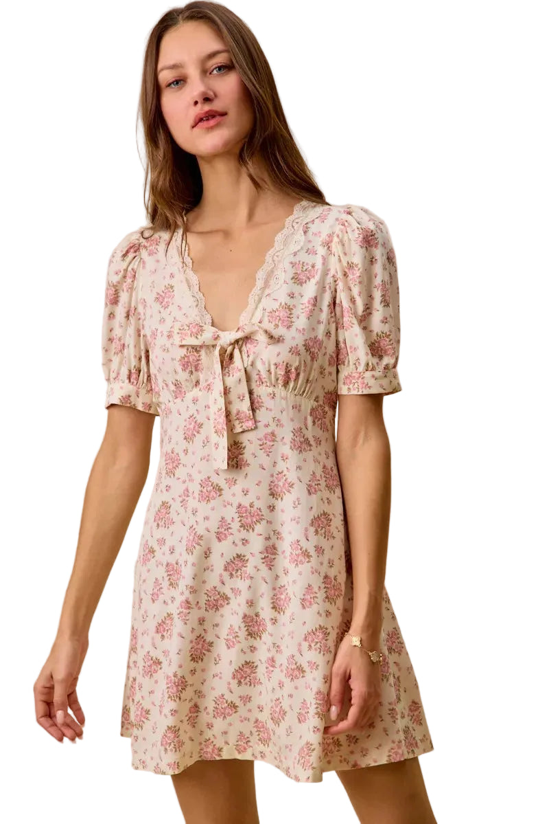 Floral cream mini dress with lace trim, bow tie neckline and puff sleeves