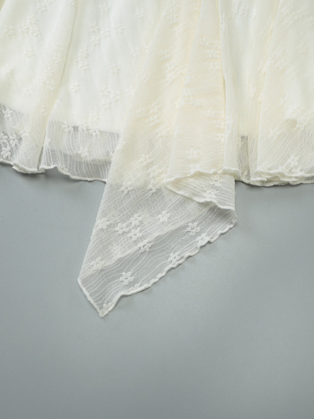 Cream mini dress with lace trim asymmetrical hem