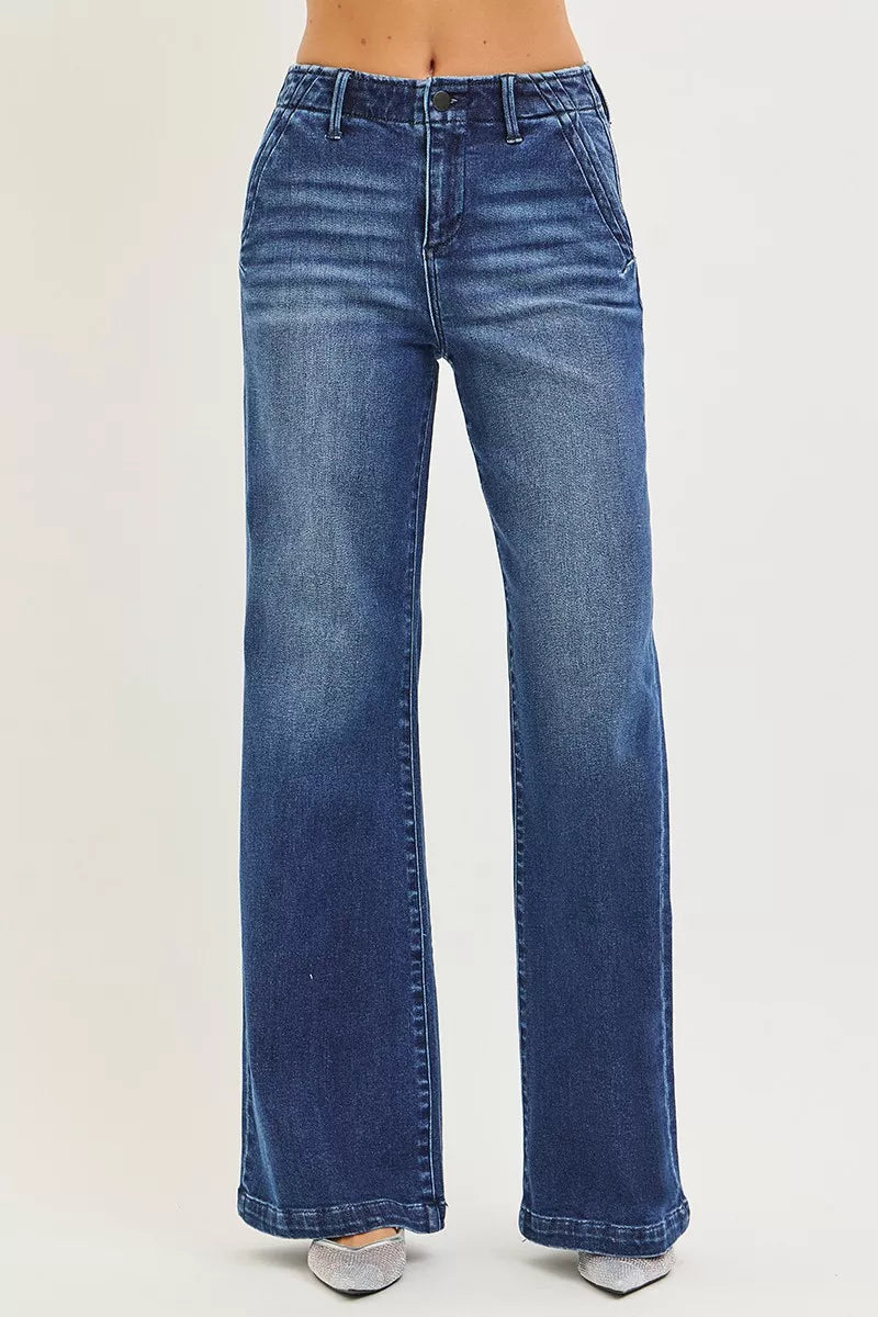 Dark wash high-rise wide-leg jeans with straight center seam and wide hems