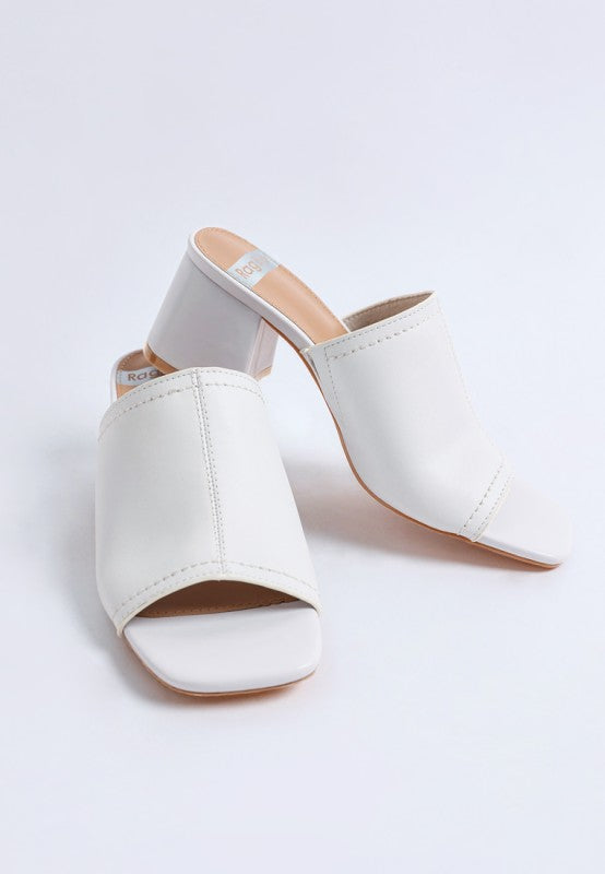 White open-toe mules with soft leather upper and chunky block heel